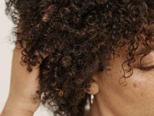 woman running fingers through curls